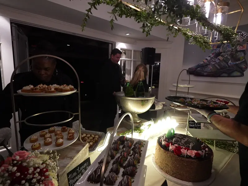 Tiered dessert tower beside a chilled champagne bucket